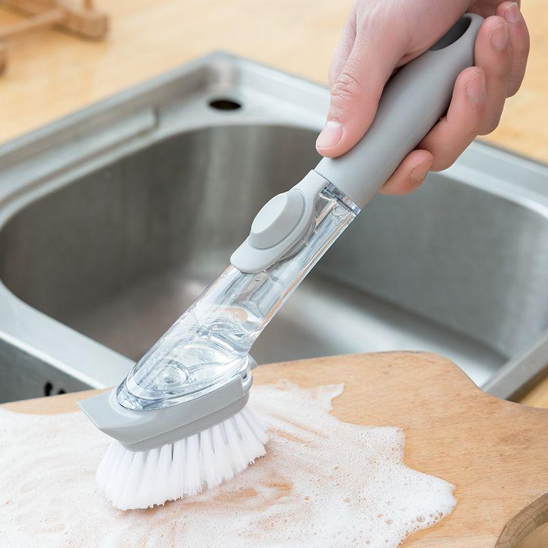 SOAP DISPENSING BRUSH